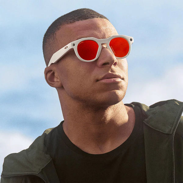 Man wearing round white sunglasses
